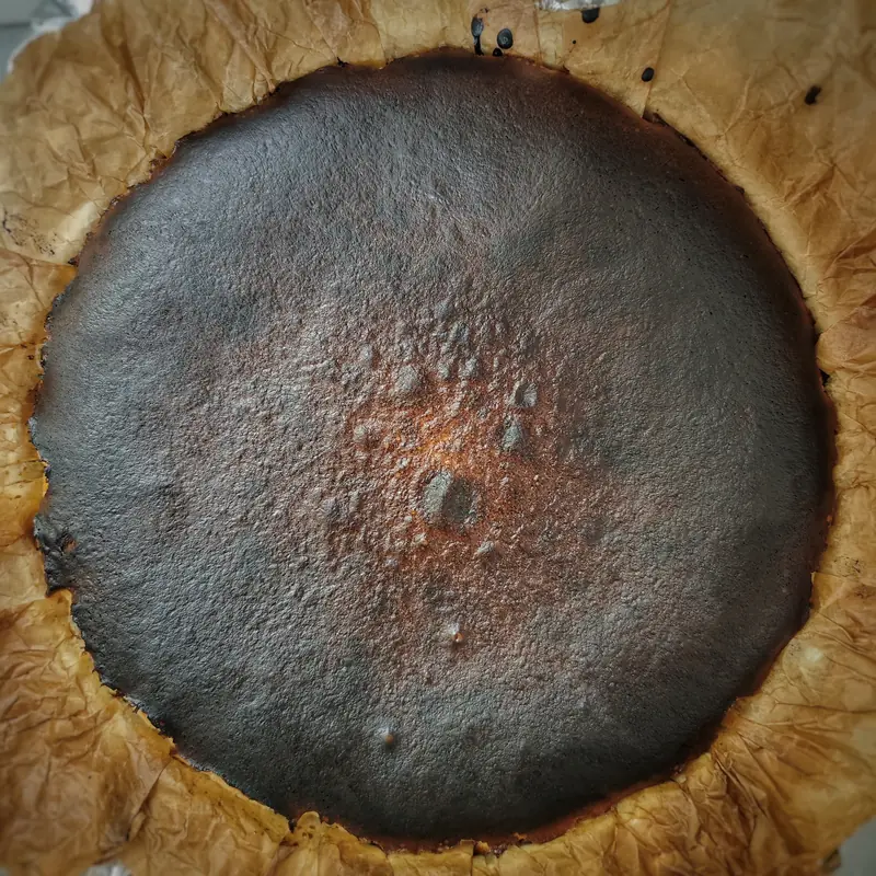burnt. basque burnt cheesecake with a dark caramelised top, seen from above